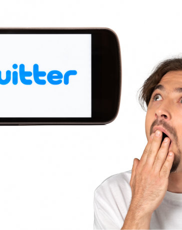 This is a man shocked on a cellphone with a Twitter app