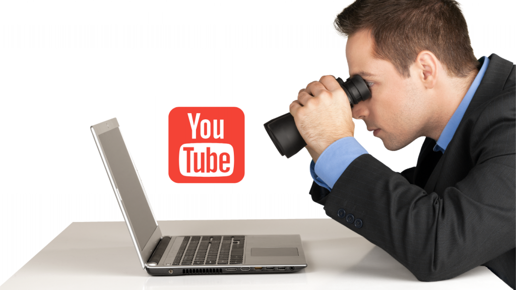 A man looking at his laptop checking for his video content and youtube content for youtube marketing